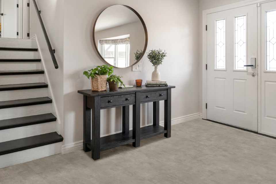 modern concrete look luxury vinyl tile in open airy white entryway